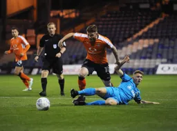 Jordan Cook goes for the ball