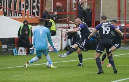 Scott Cuthbert tries to nutmeg Aaron Chapman