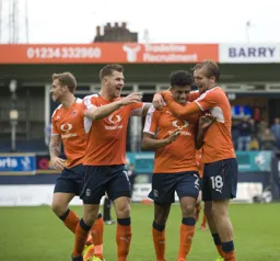 Johnny Mullins, James Collins and Luke Berry help James Justin celebrate his goal