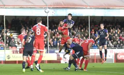 Glen Rea rises highest to head the ball forward