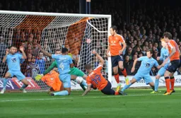 James Collins goes to ground but cannot force the ball home