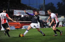 Olly Lee is at full stretch to reach the ball