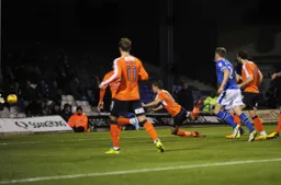Dan Potts dives in to head Town`s second goal