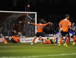 Dan Potts is flat out after heading in the second goal