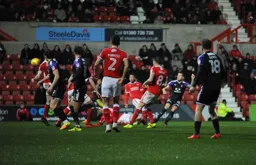 James Collins watches the ball as it heads towards the goal for Town`s first goal
