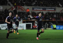 Harry Cornick is happy after scoring Town`s fourth goal