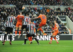 Harry Cornick and Glen Rea challenge for a high ball