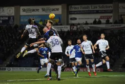 Glen Rea gets his head to the ball as Aaron Ramsdale comes out fists flying