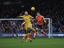Dan Potts wins a header