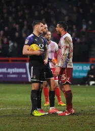 James Collins and former Hatter Ronnie Henry have a bit of a disagreement