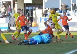 Flynn Downes and James Collins try to force the ball into the net