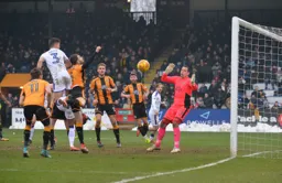 Dan Potts sends a header towards goal