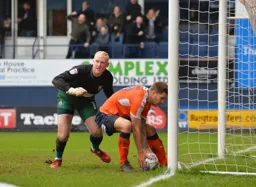James Collins picks the ball out of the net after scoring Town`s first goal