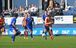 Danny Hylton gets his head down and chases the ball