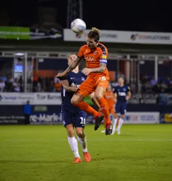 Glen Rea heads the ball