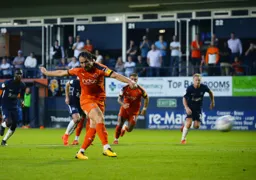 Danny Hylton scores from the penalty spot