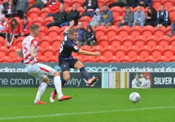 James Collins goes for goal