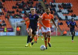 Harry Cornick trying to win the ball