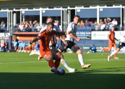 Elliot Lee looks to get the ball goalwards