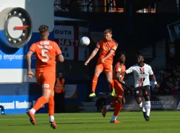 Jack Stacey heads the ball