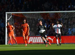 James Shea holds the ball
