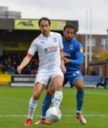 Danny Hylton keeps possession of the ball