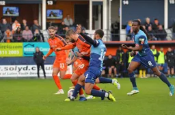 Olly Lee battles for the ball