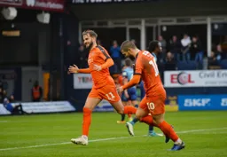 Andrew Shinnie celebrates scoring the opener