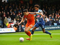 Harry Cornick looks to get to the ball first