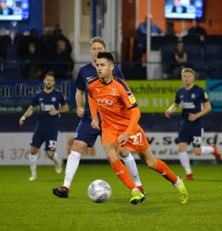 Aaron Jarvis moves forward with the ball