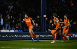 Danny Hylton celebrates after forcing the own goal