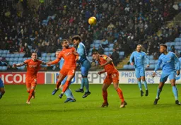 Elliot Lee heads towards goal