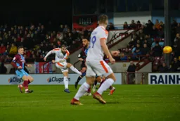 Elliot Lee goes for goal