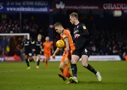 James Collins holds the ball up