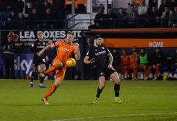 James Collins wins the ball