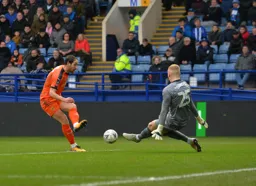 Danny Hylton goes for goal