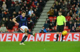 James Collins takes the shot