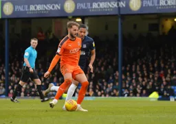 Andrew Shinnie looks to set up another attack