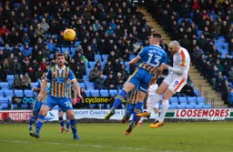 Danny Hylton heads at goal