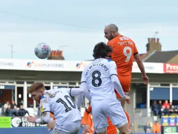 Danny Hylton jumps highest to win the header