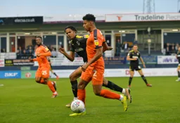 James Justin sheilding the ball