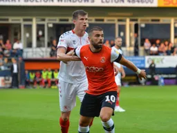 Elliot Lee spinning away from his marker Paddy McNair