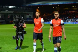 James Collins and Sonny Bradley walking off the pitch after media duties post Middlesbrough