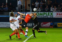 James Collins gets to the ball ahead of Darren Randolph but doesn't hit the target