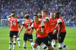 The Town players celebrating thinking they snatched a point with a late Matty Pearson goal before late heartbreak from Isaac Vassell