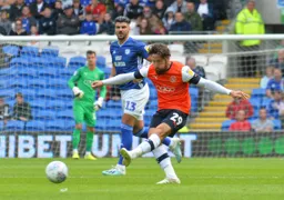Jacob Butterfield plays a ball across midfield