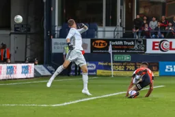 Lloyd Jones loops a brilliant header over Will Norris