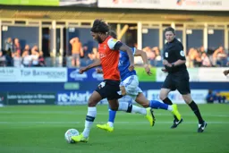 Izzy Brown drives forward with the ball