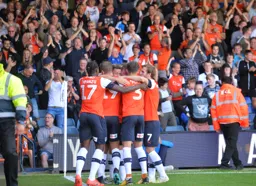 The team celebrate with Harry Cornick after his goal