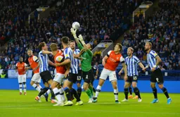 Goalmouth scramble, Kieran Westwood clamours to get to grips with the ball